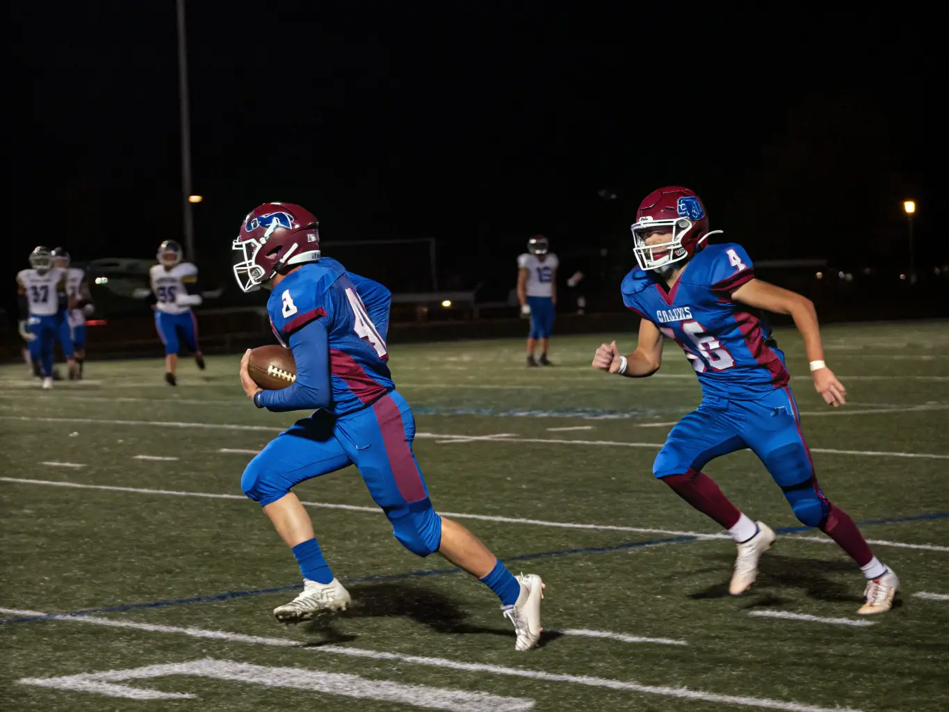 An action shot of players competing in a local football league match organized by ASSOCIATION SPORTIVE DE SAINT BEAUZELY, capturing the intensity and competitive spirit of the game.